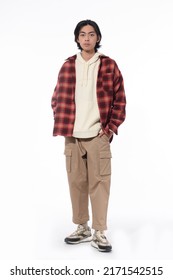 Full Body Young Man Wearing Striped Shirt With Khaki Pants Standing In Studio