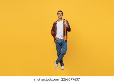 Full body young middle eastern man 20s he wear casual shirt white t-shirt hold takeaway delivery craft paper brown cup coffee to go isolated on plain yellow background studio People lifestyle concept - Powered by Shutterstock