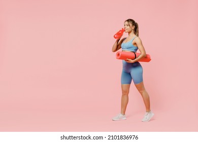 Full Body Young Strong Sporty Athletic Fitness Trainer Instructor Woman Wear Blue Tracksuit Spend Time In Home Gym Hold Mat Drink Water Isolated On Pastel Plain Pink Background Workout Sport Concept