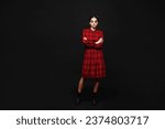 Full body young woman with Halloween makeup face art mask wear clown costume red dress hold hand crossed folded look camera isolated on plain solid black background studio. Scary holiday party concept