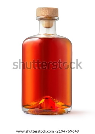 A full bottle of whiskey is isolated on a white background