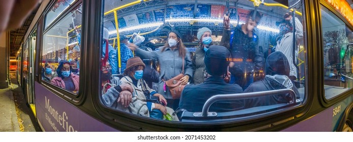 A Full Bus Of People In A Rush-hour, Passengers In Coats Inside The MTA Bus At Night, White Plains Road, New York, Very Wide Shoot Panorama,  Bronx, United States Of America, 11.08.2021