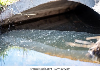 Full Capacity Concrete Culvert With Sheen Contaminated Storm Water Runoff