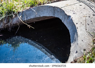 Full Capacity Concrete Culvert With Sheen Contaminated Storm Water Runoff