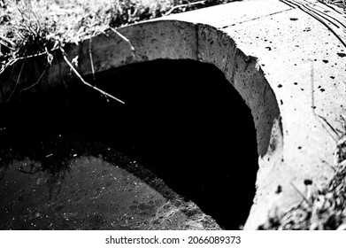 Full Capacity Concrete Culvert With Sheen Contaminated Storm Water Runoff