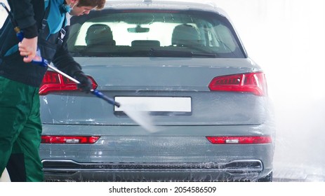 Full Car Wash At The Self Service. Splashed Drops Of Water From A Sprayer Washing The Car. Windshield