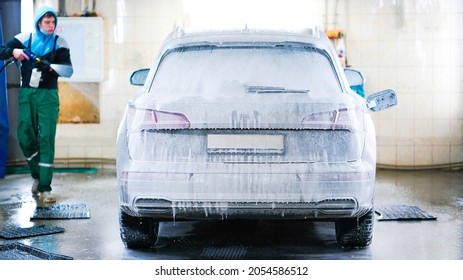 Full Car Wash At The Self Service. Splashed Drops Of Water From A Sprayer Washing The Car. Windshield