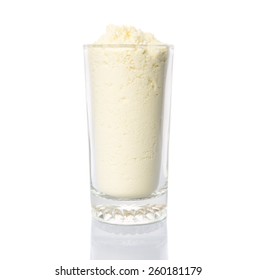 Full Cream Milk Powder In A Glass Over White Background