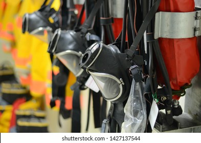 Full face mask with self contained breathing apparatus (SCBA) including fire suit and personal protective equipment (PPE) on the wall to stand by for firefighters at chemical plants, power plants. - Shutterstock ID 1427137544