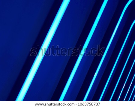 Full frame abstract image of vibrant blue light trails
