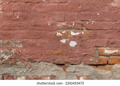 Full Frame Abstract Texture Background Of A Shabby Chic Old Rose Color Painted Clay Brick Wall With An Artsy Deteriorating Appearance