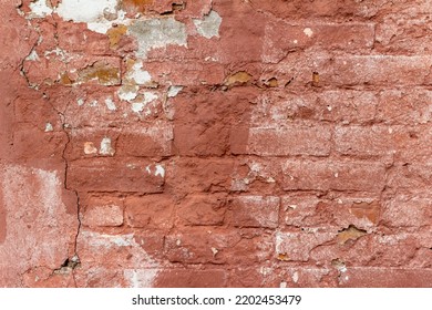 Full Frame Abstract Texture Background Of A Shabby Chic Old Rose Color Painted Clay Brick Wall With An Artsy Deteriorating Appearance