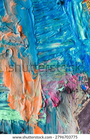 Full frame abstract texture of thick colorful paint strokes