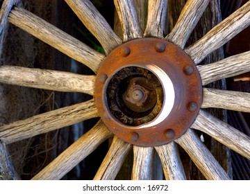 A full frame aged and rusty wagon wheel.