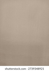 Full frame background of beige soft fabric texture. Neutral tan colored textile material with fine weave pattern for fashion or upholstery.