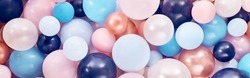 Full Frame Background Of Pile Of Various Bright Balloons Of Different Colors And Sizes Stacked Together In Light Decorated Room During Festive Event Celebration
