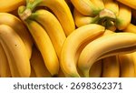 Full Frame Background Texture of Ripe Yellow Bananas in a Bunch - Close-up full frame of a bunch of ripe bananas.