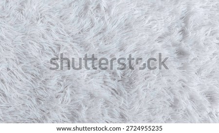 Full Frame Background of White Long Hair Faux Fur Rug Texture for Cosy Interior Design