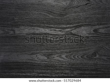 a full frame black wood grain surface
