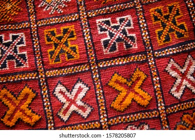 Full Frame Close Up Of The Colorful Textured Patterns Of An Antique Morrocan Rug In Marrakech, Morocco