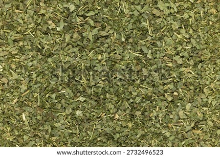 Full frame close up macro shot of dried Basil herbs