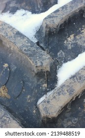 Full Frame Closeup Of A Huge Farm Tractor Tire With Ridges And Grips.