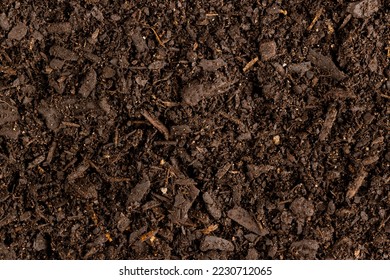 Full frame of dark rich peat soil and bark pieces. Ecology, growth, care and nature concept. - Shutterstock ID 2230712065