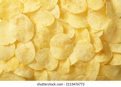 Full frame foodbackground of potato chips, top view