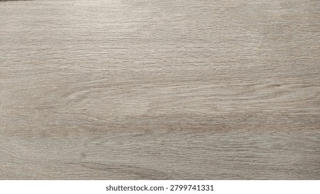 Full frame high-angle shot of durable ceramic tile flooring featuring a realistic light brown wood grain texture and grout lines, ideal for modern interior design backdrops.