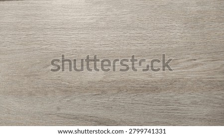 Full frame high-angle shot of durable ceramic tile flooring featuring a realistic light brown wood grain texture and grout lines, ideal for modern interior design backdrops.
