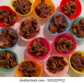 Full Frame Image Of Cornflake Chocolate Crispy Cakes In Coloured Paper Cases