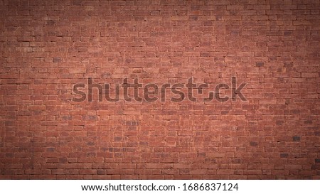 Full frame image of the old painted red brick wall. High resolution texture (16:9 format) with dark vignetted corners for background, poster, collage in grubge, urban, loft style