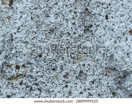 Full frame macro background of crystalline igneous rock surface with detailed mineral grains