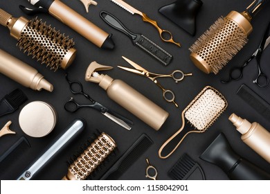 Full frame of professional hair dresser tools on black background