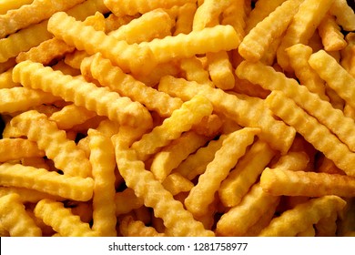 Full Frame Rippled French Fries Or Chips In Overhead View For Advertising Concept.