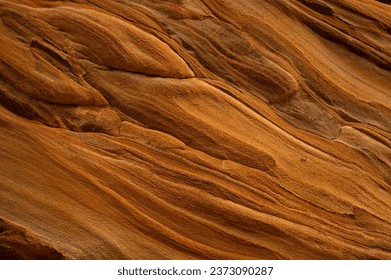 Full frame of sandstone rock pattern, Rock formation, natural of sand stone on beach in Australia, line and curve of stone use for background - Powered by Shutterstock