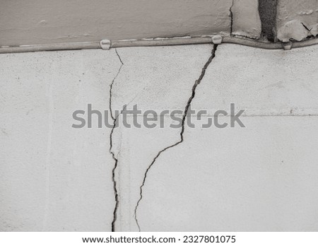 Full frame shot of cracked wall. Wider cracks often represent serious structural damage and can cause serious issues.