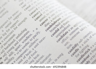 Full frame shot of dictionary with focus on cancer