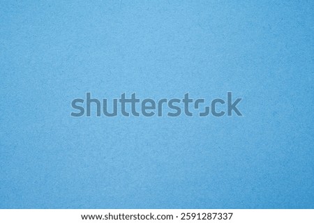 Full frame shot of light blue paper sheet texture and background. Colored paper or construction paper, is a type of paper that comes in a wide range of colors.