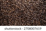 Full frame texture background of dark roasted coffee beans close-up