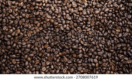 Full frame texture background of dark roasted coffee beans close-up