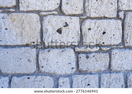 Full Frame Texture of a Rustic Natural Limestone Wall with Mortar Joints