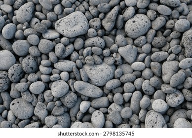 Full Frame Top Down View Of Textured Dark Gray Volcanic Pebbles And Lava Stones