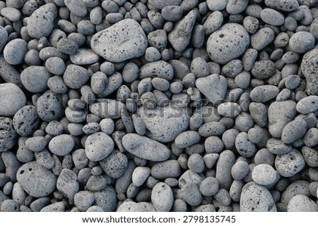 Full Frame Top Down View Of Textured Dark Gray Volcanic Pebbles And Lava Stones