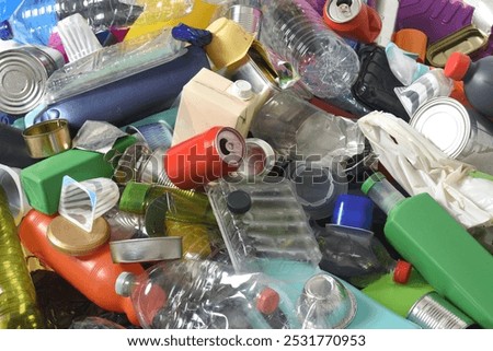 full frame of trash plastics and cans on white background