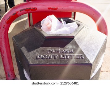 A Full Garbage Can With Sunbeam. Don't Litter Concept.