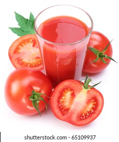 Full Glass Of Fresh Tomato Juice And Plants Near It.