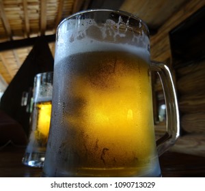 Full Glasses Of Beer On The Bar Desk At Country Style Bar 