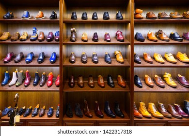 Full Grain Leather Shoes On Wooden Display In Men Shoes Boutique Store. Black, Brown And Other Colors.