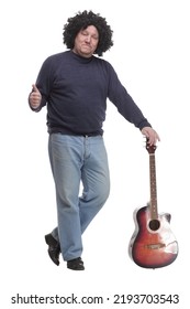 In Full Growth. Curly-haired Mature Man With A Guitar.